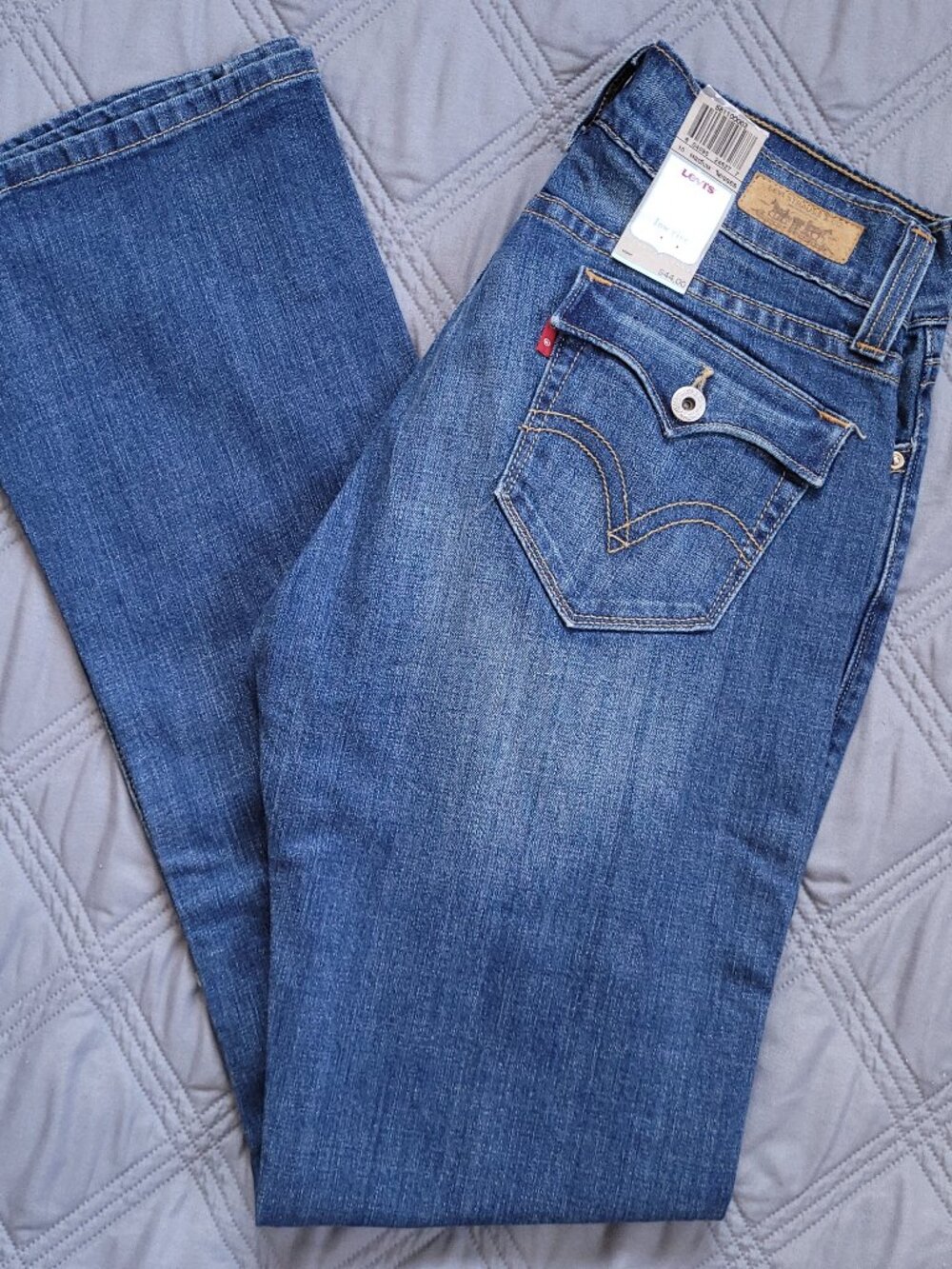 New Levi's Tilted Flare 542 low rise jeans in medium wash